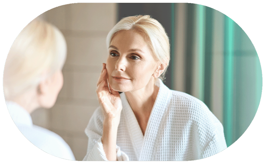 mature lady applying skin cream